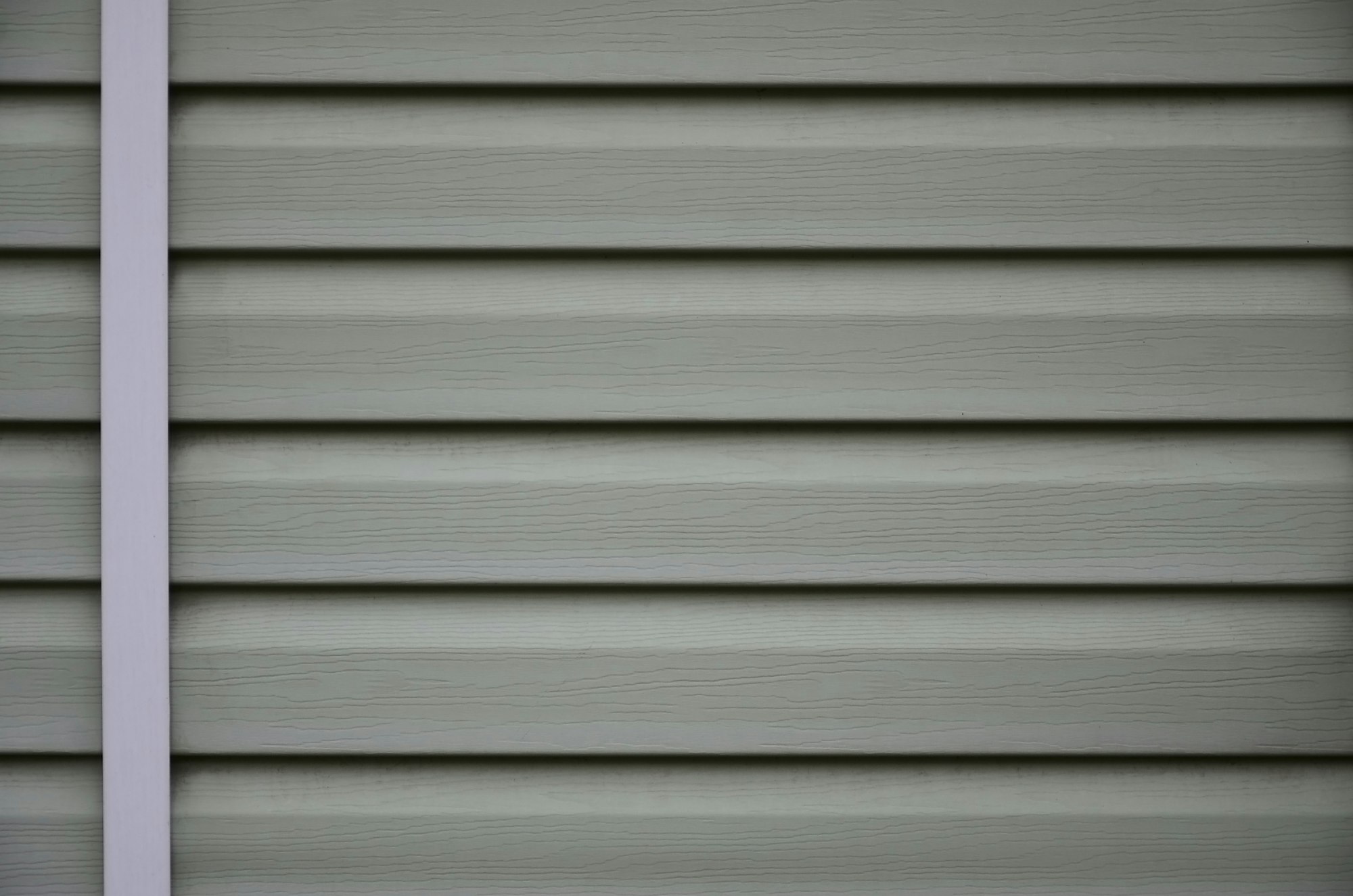Siding, plastic panels texture closeup in the daytime outdoors